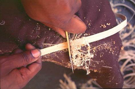 Splits are smoothed by shaving with a knife before weaving.