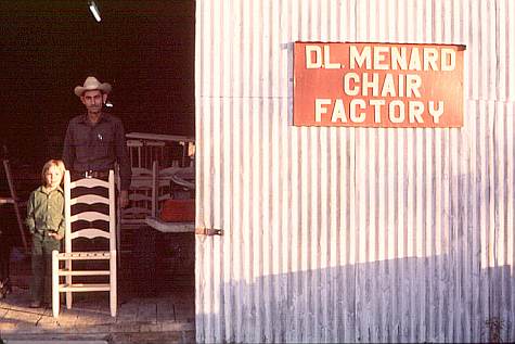 D.L. Menard stands in front of his original chair factory in Erath. This well-known factory has been rebuilt since it burned. 