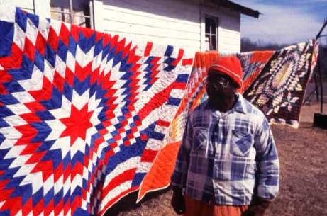 Essie Entoe of Chatham, Jackson Parish shows her star quilts.